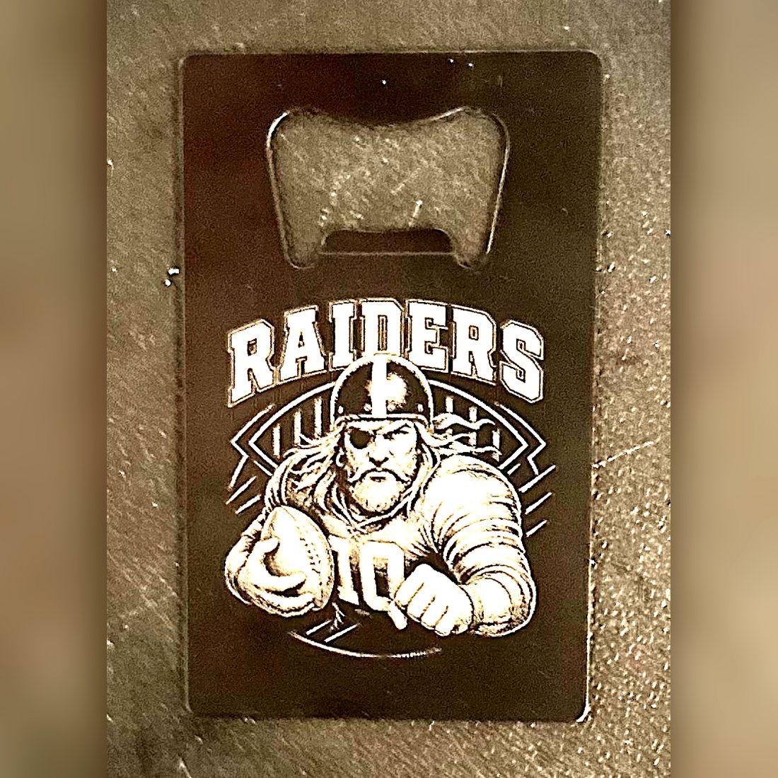 Raiders credit-card bottle opener